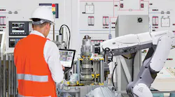 man-controlling-robotic-arm