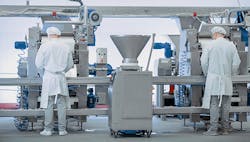 1660317237270 Twoworkersatafoodproductionline 1660317237270 Twoworkersatafoodproductionline