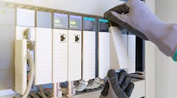 Electrical-and-Instrument-technician-replacing-input-and-output-card-of-programable-logic-controller Electrical-and-Instrument-technician-replacing-input-and-output-card-of-programable-logic-controller