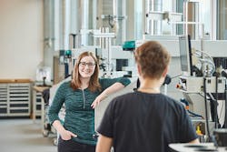 Image-of-two-people-talking-in-traning-center Image-of-two-people-talking-in-traning-center