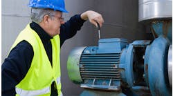technician-performing-maintenance-on-large-industrial-motor