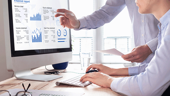 1663606651589 Twobuesinessmenreviewingfinancialstatementonacomputerscreen