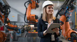 photo-of-female-engineer-in-front-of-robotic-arms
