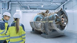 engineers talking with virtual simulation of engine cutout in background engineers talking with virtual simulation of engine cutout in background