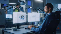 Industrial Engineer Solving Problems, Working on a Personal Computer, Two Monitor Screens Show CAD Software