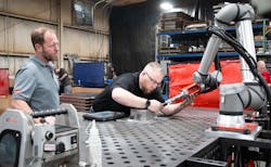 Turnkey systems for cobot welding, as seen here at sheet metal manufacturer Raymath in Ohio, is one of the solutions Universal Robots predicts will drive automation in 2023. Raymath’s CEO wrote the purchase order right after experiencing a hands-on programming demo. Turnkey systems for cobot welding, as seen here at sheet metal manufacturer Raymath in Ohio, is one of the solutions Universal Robots predicts will drive automation in 2023. Raymath’s CEO wrote the purchase order right after experiencing a hands-on programming demo.