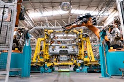 Mobile platforms transport truck cabins in and out of welding cell. (Source: Kuka Robotics) Mobile platforms transport truck cabins in and out of welding cell. (Source: Kuka Robotics)