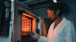 Purdue student Anna Murray places printed circuit board samples into an oven to test for stability and other important qualities in electronic components. The latest funding round for the SCALE workforce development program helps students build these skills to use in microelectronics work.