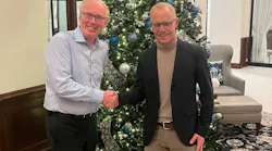 Marcel van Helten, CEO, Red Lion Controls, and Staffan Dahlström, CEO, HMS Networks, shake hands after signing.