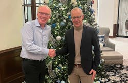 Marcel van Helten, CEO, Red Lion Controls, and Staffan Dahlström, CEO, HMS Networks, shake hands after signing. Marcel van Helten, CEO, Red Lion Controls, and Staffan Dahlström, CEO, HMS Networks, shake hands after signing.