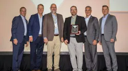 Kundinger representatives are accepting the award from Parker Hannifin representatives at the Parker National Sales Meeting: Michael Delaney (from left), vice president of industrial sales and distribution, Parker; Michael O’Hara, vice president of global sales and marketing, Parker; Tom E. Kundinger, vice president and chief operating officer, Kundinger; Paul Kundinger, president, Kundinger; Andrew Ross, president and chief operating officer, Parker; and Douglas Gilbert, vice president of sales and marketing, Parker.