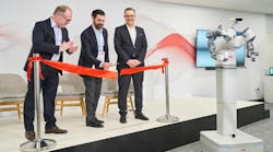 ABB&apos;s Marc Segura, John Bubnikovich and Sami Atiya cut the ribbon on ABB Robotics renovated facility.