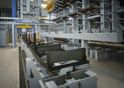 Figure 2: A 20-meter-high building towers between the administration facilities and the new production halls, accommodating a high-bay warehouse and sawing center. Figure 2: A 20-meter-high building towers between the administration facilities and the new production halls, accommodating a high-bay warehouse and sawing center.