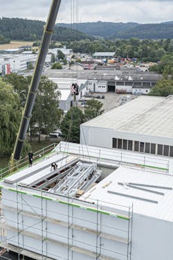 Figure 3: The first step was opening the roof, and then the refurbishment of the Kasto bar high-bay storage system at G&uuml;nther+Schramm could begin.