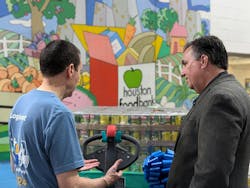 Mitsubishi Logisnext President Ken Barina (left) and Houston Food Bank President/CEO Brian Greene brought their organizations together to help feed people. Mitsubishi Logisnext President Ken Barina (left) and Houston Food Bank President/CEO Brian Greene brought their organizations together to help feed people.