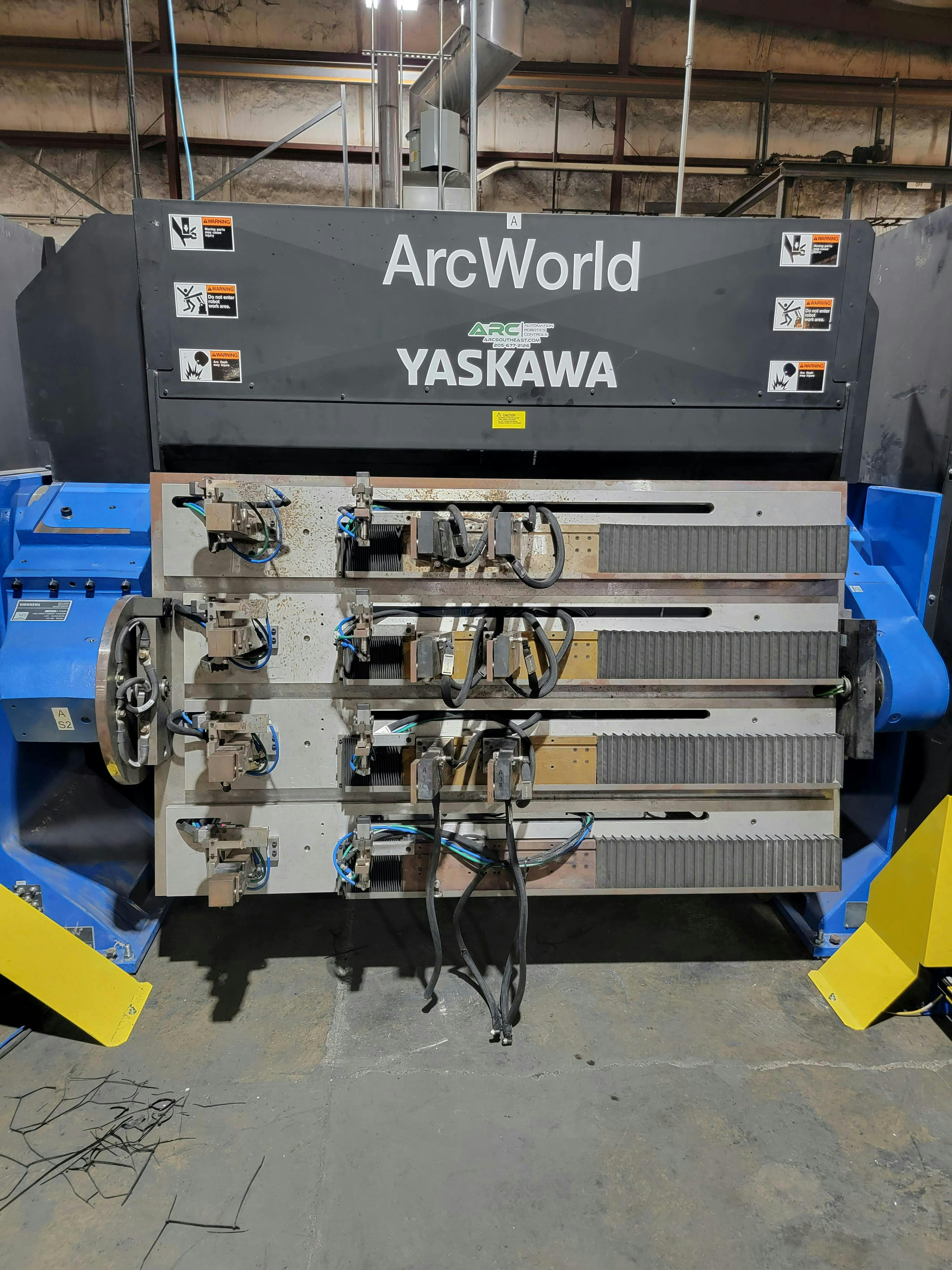 Figure 1: ARC designed a fixture for a robotic system to load four helical anchors into a customer welding machine. Figure 1: ARC designed a fixture for a robotic system to load four helical anchors into a customer welding machine.