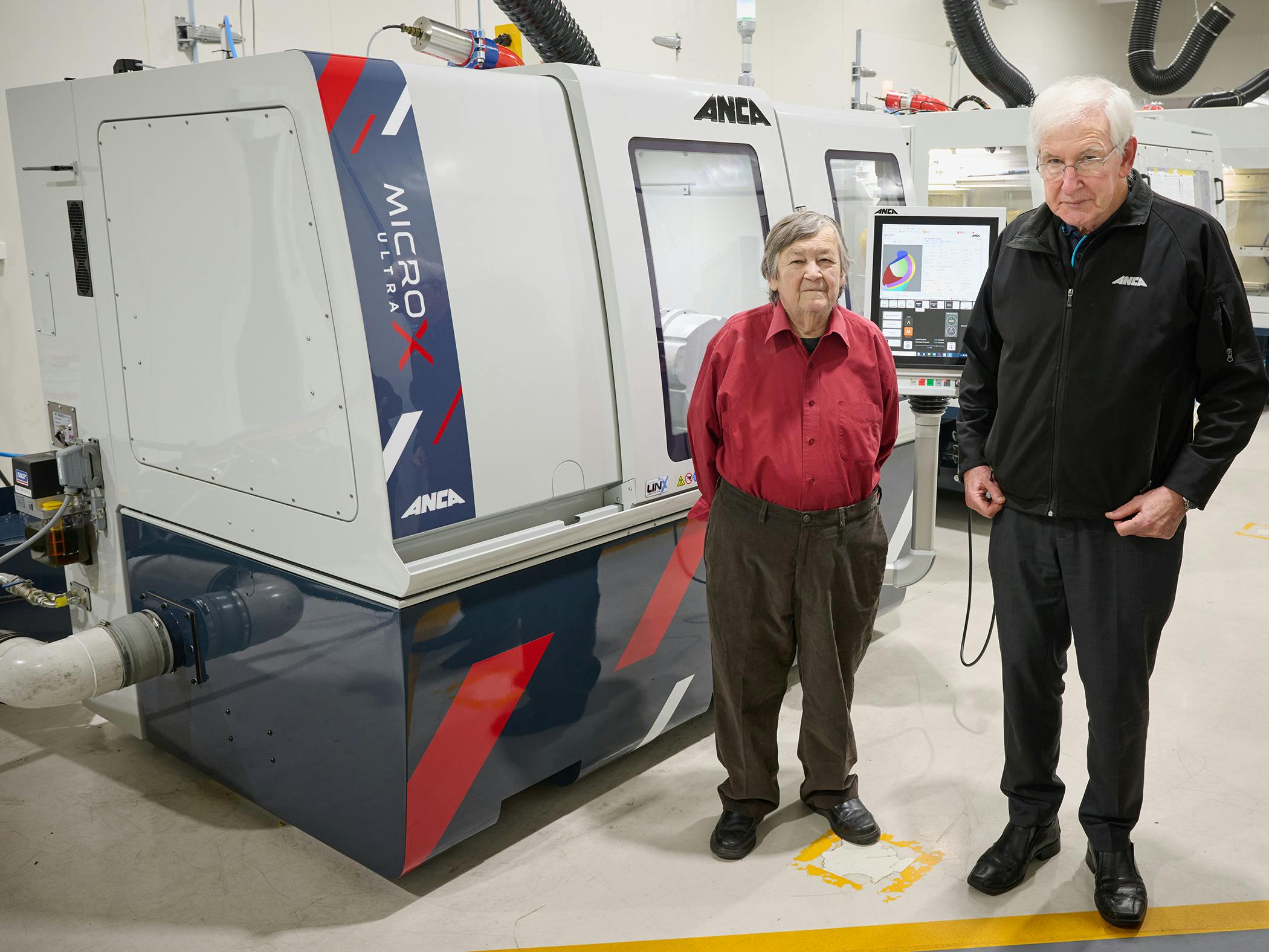 Pat McCluskey (left) and Pat Boland with ANCA technology.