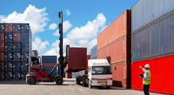Foreman control loading Containers box from Cargo freight ship for import export Foreman control loading Containers box from Cargo freight ship for import export