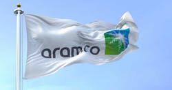 The flag of the Aramco oil company waving in the wind The flag of the Aramco oil company waving in the wind