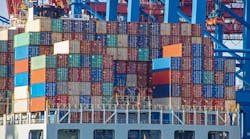 Container ship with colorful containers on the vessel quayside in the freight terminal of the harbor Container ship with colorful containers on the vessel quayside in the freight terminal of the harbor
