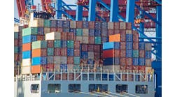 Container ship with colorful containers on the vessel quayside in the freight terminal of the harbor Container ship with colorful containers on the vessel quayside in the freight terminal of the harbor