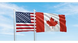 United States and Canada flags, two flags waving on sky background United States and Canada flags, two flags waving on sky background