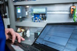 Programmer of PLC checks correct function of program Programmer of PLC checks correct function of program