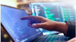 Computer engineer is typing console script code by hand Computer engineer is typing console script code by hand