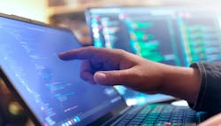 Computer engineer is typing console script code by hand Computer engineer is typing console script code by hand