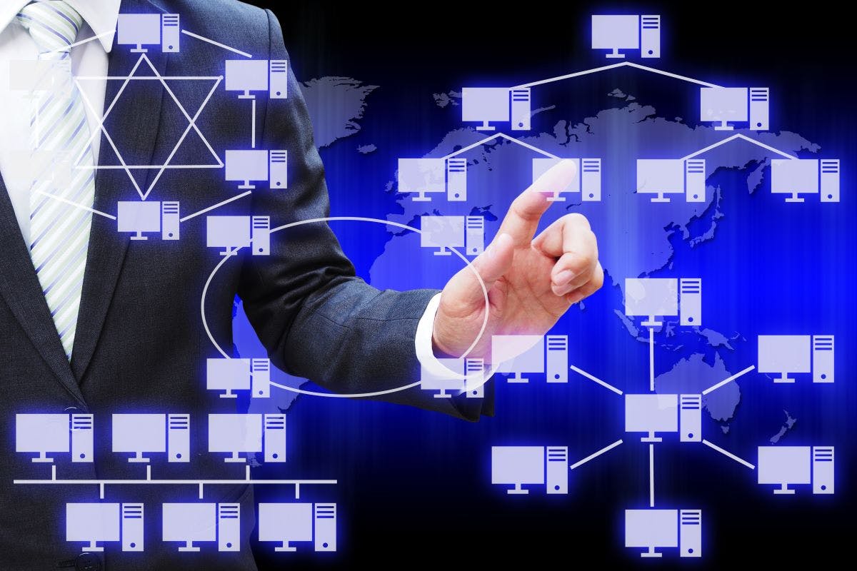 Businessman hand touching virtual panel of virtual panel of computer network topology