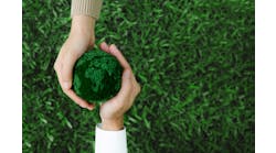 Two hands holding green earth together on nature background for the Sustainable Development Goals Two hands holding green earth together on nature background for the Sustainable Development Goals