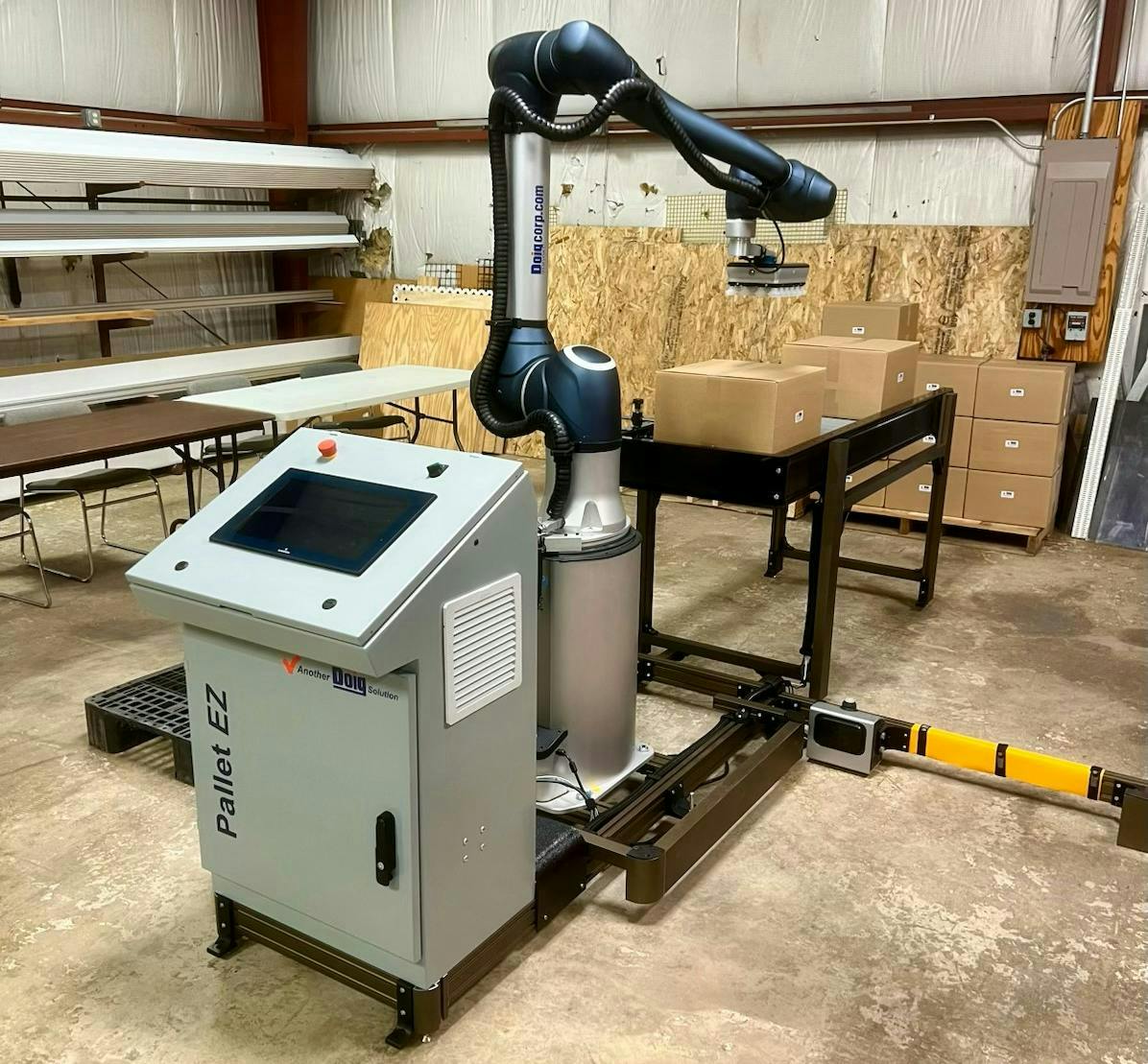 Figure 1: Doig’s cobot palletizing setup, Pallet EZ, handles and stacks goods on pallets. Figure 1: Doig’s cobot palletizing setup, Pallet EZ, handles and stacks goods on pallets.