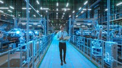 Engineer With Laptop Activates Autonomous EV Factory Digitization Engineer With Laptop Activates Autonomous EV Factory Digitization