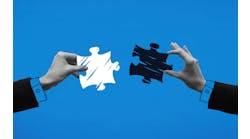 Hands holding puzzle pieces and trying to connect it against blue background. Hands holding puzzle pieces and trying to connect it against blue background.