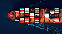 Aerial view of a cargo ship carrying colorful containers, cutting through deep blue waters with visible wave patterns. Aerial view of a cargo ship carrying colorful containers, cutting through deep blue waters with visible wave patterns.