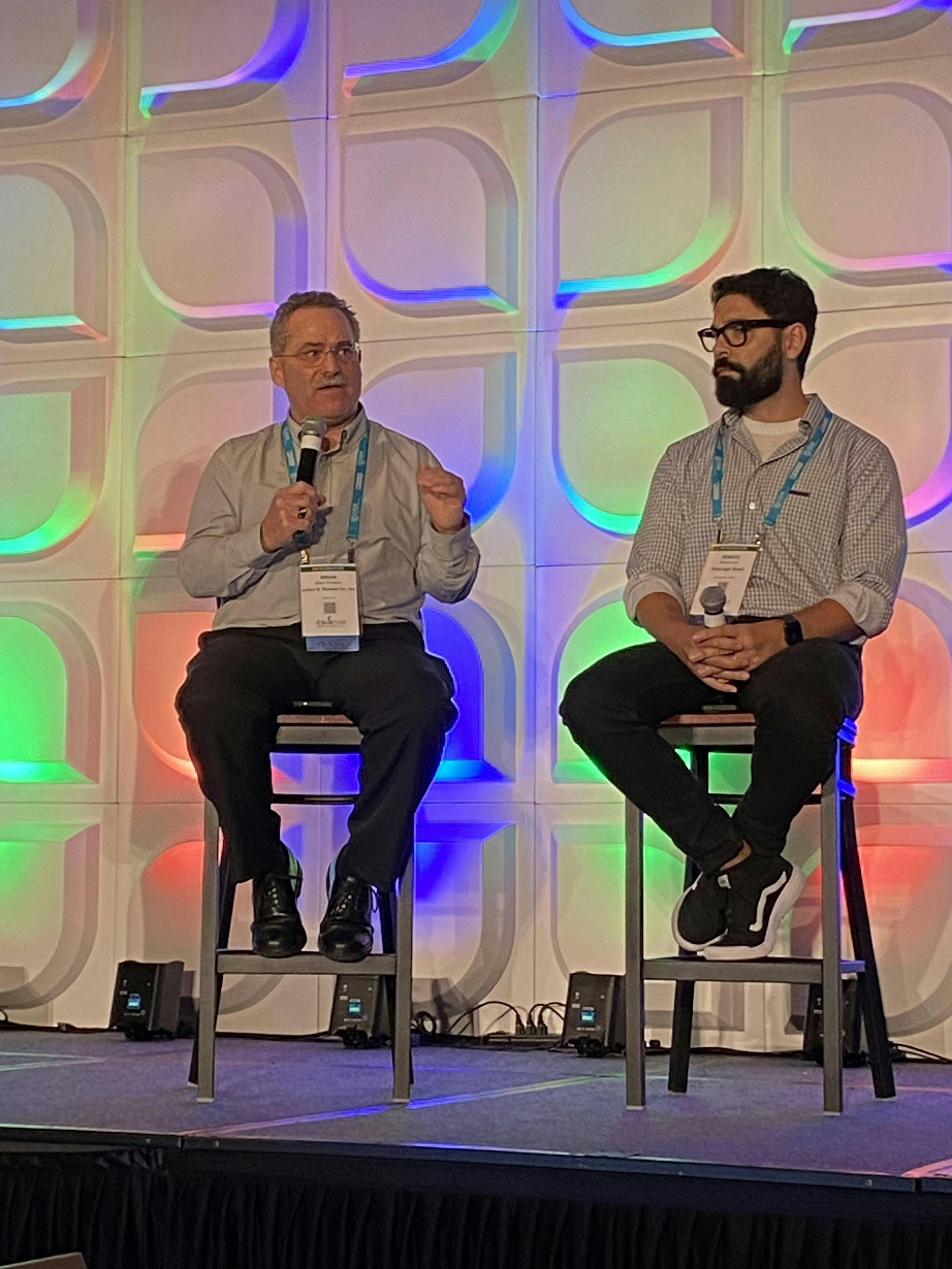 Figure 1: Arthur G. Russell’s Dr. Brian Romano discusses digital transformation at the CSIA 2025 Conference as GreyLogix Brasil’s Renato Leal listens.