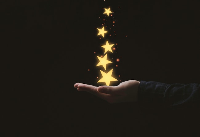 Hand holding stars