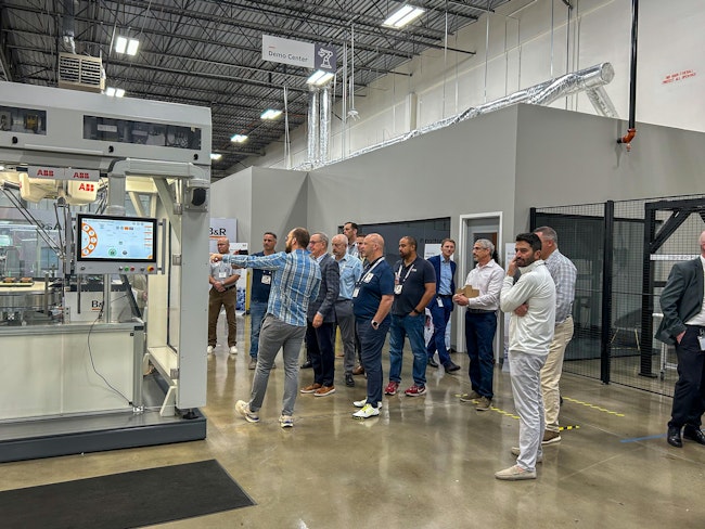 An executive group tours B&R's office in Alpharetta, Georgia, visiting the Innovation Space.