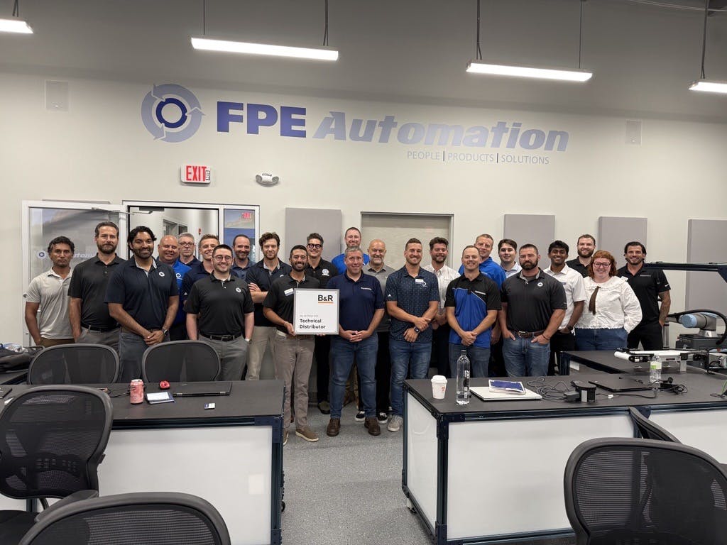 Shaun Kneller, director of global accounts and end user sales US at B&R, presents the official B&R Technical Distributor plaque to the FPE Automation team.