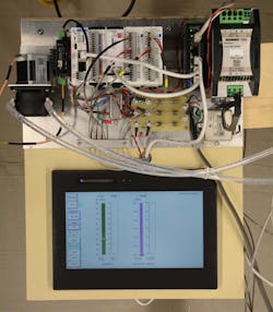 Figure 4: The compact PLC and I/O, HMI, the stepper drive, the motor/pump and associated components are all mounted on a common backplate with thorough grounding to minimize noise in the temperature data. Figure 4: The compact PLC and I/O, HMI, the stepper drive, the motor/pump and associated components are all mounted on a common backplate with thorough grounding to minimize noise in the temperature data.