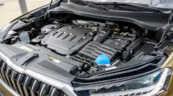 A view of the engine compartment of a modern brown combustion SUV with a large spacious body
