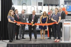 On stage for the ribbon cutting ceremony were (from left) Peter Fox, Somic Packaging CEO; James Schollett, president of the German American Chamber of Commerce Minnesota chapter; Patrick Bonetsmuller, Somic chairman; Brenda Dietrich, mayor of Inver Grove Heights; Dr. Gerhard Huber, CEO of Somic Group; and Tim Haase, COO of Somic Group. On stage for the ribbon cutting ceremony were (from left) Peter Fox, Somic Packaging CEO; James Schollett, president of the German American Chamber of Commerce Minnesota chapter; Patrick Bonetsmuller, Somic chairman; Brenda Dietrich, mayor of Inver Grove Heights; Dr. Gerhard Huber, CEO of Somic Group; and Tim Haase, COO of Somic Group.