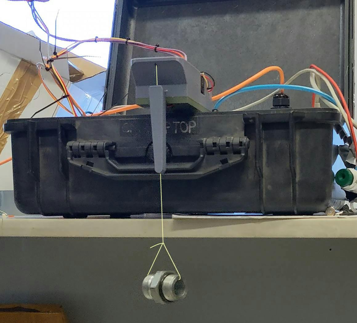 Figure 2: Before risking implementation on the massive port crane, the team constructed a small test rig in the office, a simple motorized suitcase with a suspended weight. Figure 2: Before risking implementation on the massive port crane, the team constructed a small test rig in the office, a simple motorized suitcase with a suspended weight.
