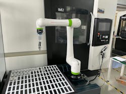 Collaborative robot (Cobot) from FANUC producer as part of production cell in show room of DMG MORI SEIKI machine tools builder in Brno in the Czech Republic. Collaborative robot (Cobot) from FANUC producer as part of production cell in show room of DMG MORI SEIKI machine tools builder in Brno in the Czech Republic.