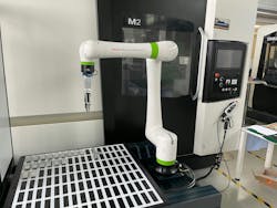 Collaborative robot (Cobot) from FANUC producer as part of production cell in show room of DMG MORI SEIKI machine tools builder in Brno in the Czech Republic. Collaborative robot (Cobot) from FANUC producer as part of production cell in show room of DMG MORI SEIKI machine tools builder in Brno in the Czech Republic.