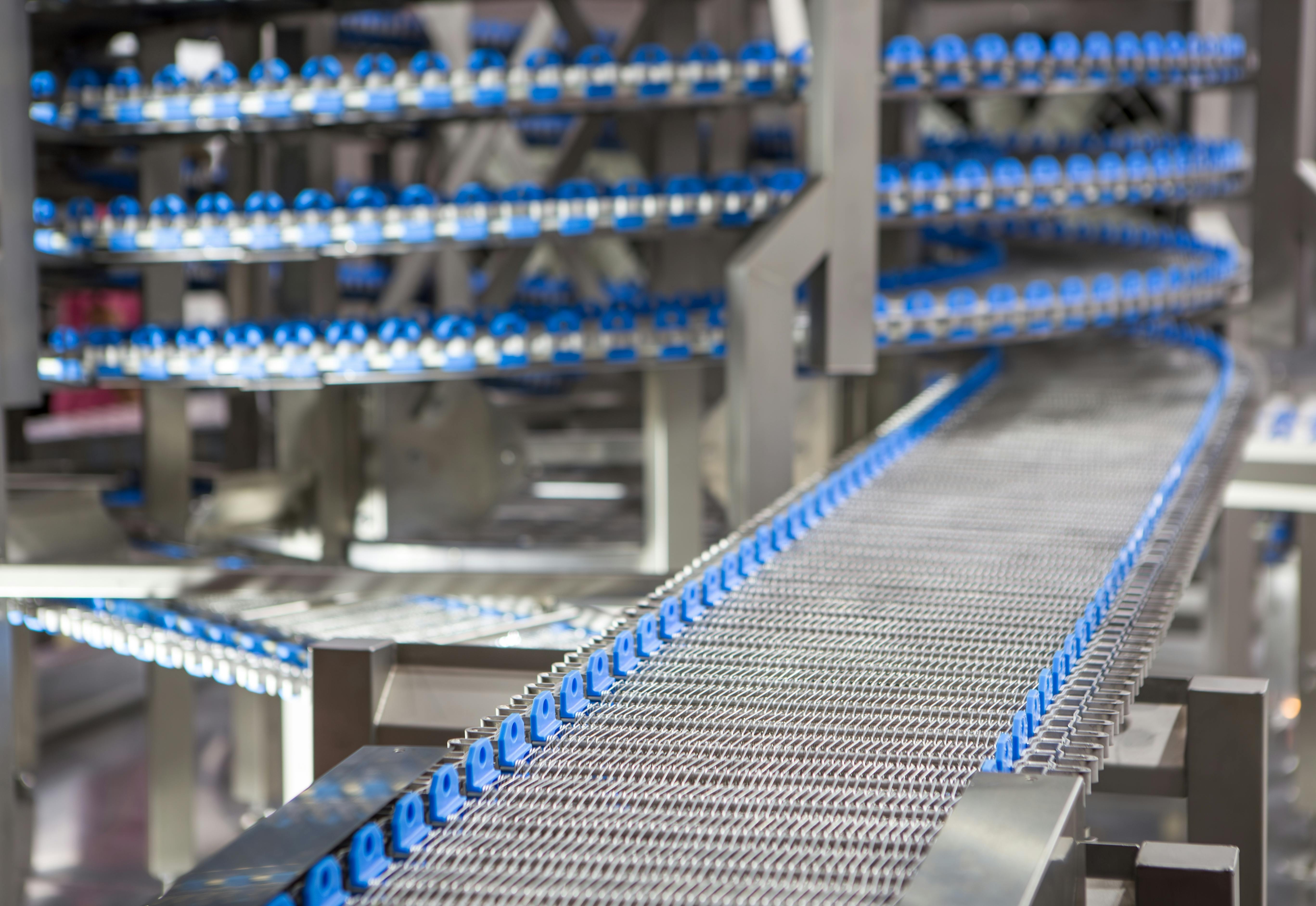 Conveyor belt system in food industry production line.