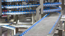 Conveyor belt system in food industry production line.