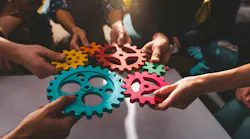 Teamwork of business people work together and combine pieces of gears