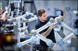 An engineer working on a collaborative robot in a Teradyne Robotics factory. An engineer working on a collaborative robot in a Teradyne Robotics factory.
