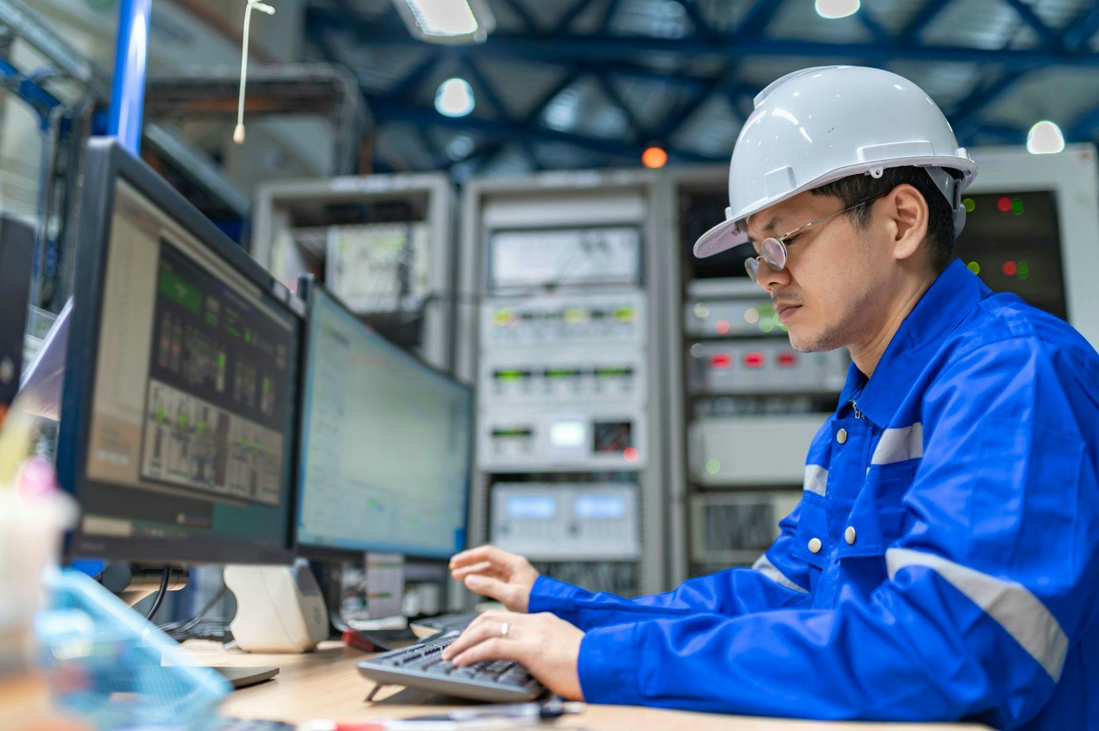 Engineer working at control room, Manager control system, Technician man monitoring program